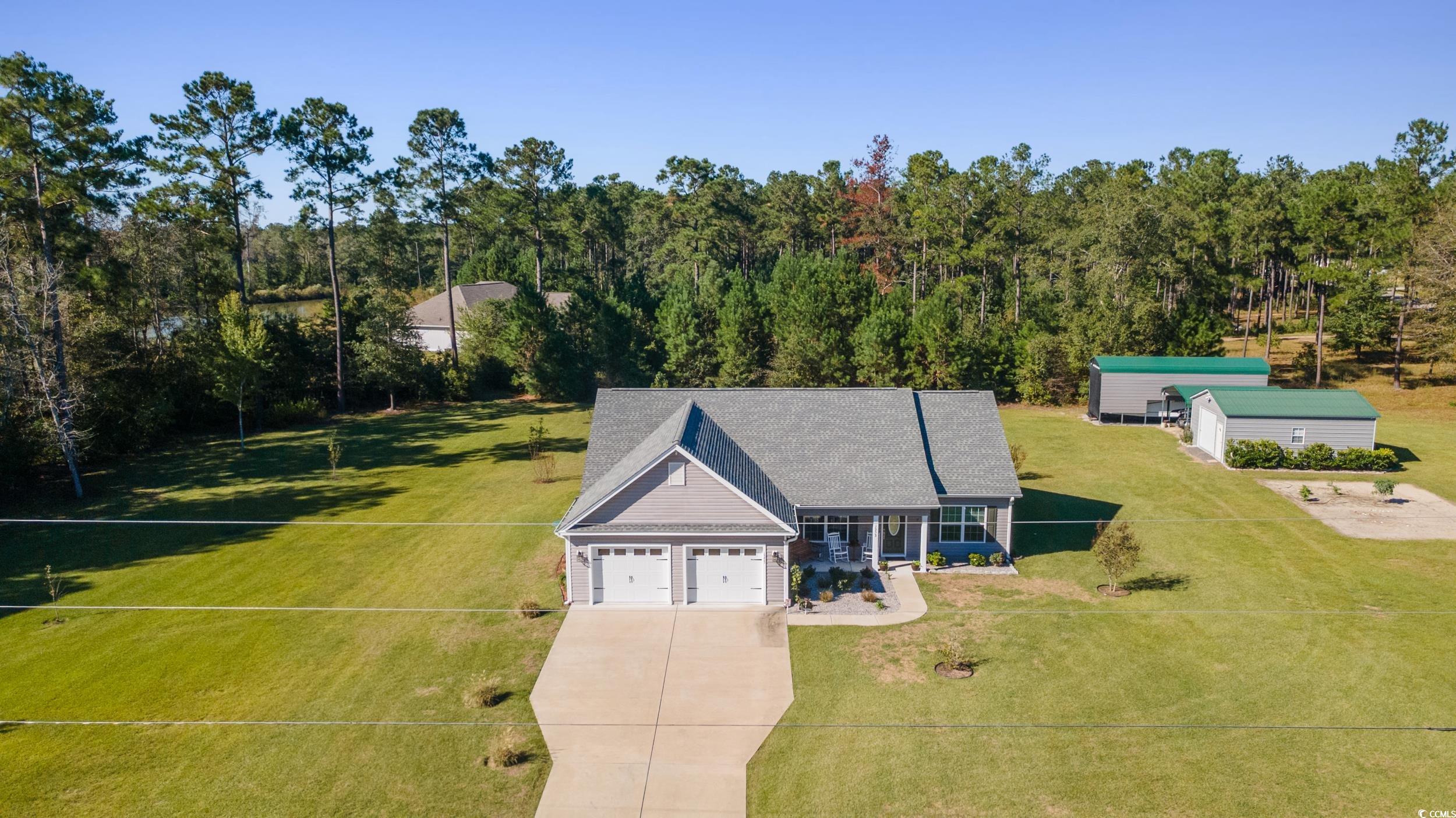 1353 Hucks Road Aynor, SC 29511 - Photo 2 of 40 Aerial view of property and surrounding area with a forest