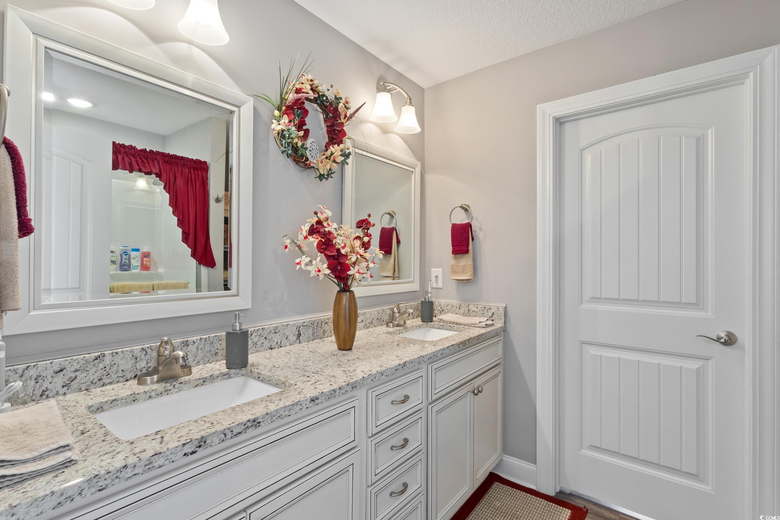 1353 Hucks Road Aynor, SC 29511 - Photo 30 of 40 Bathroom featuring double vanity and baseboards
