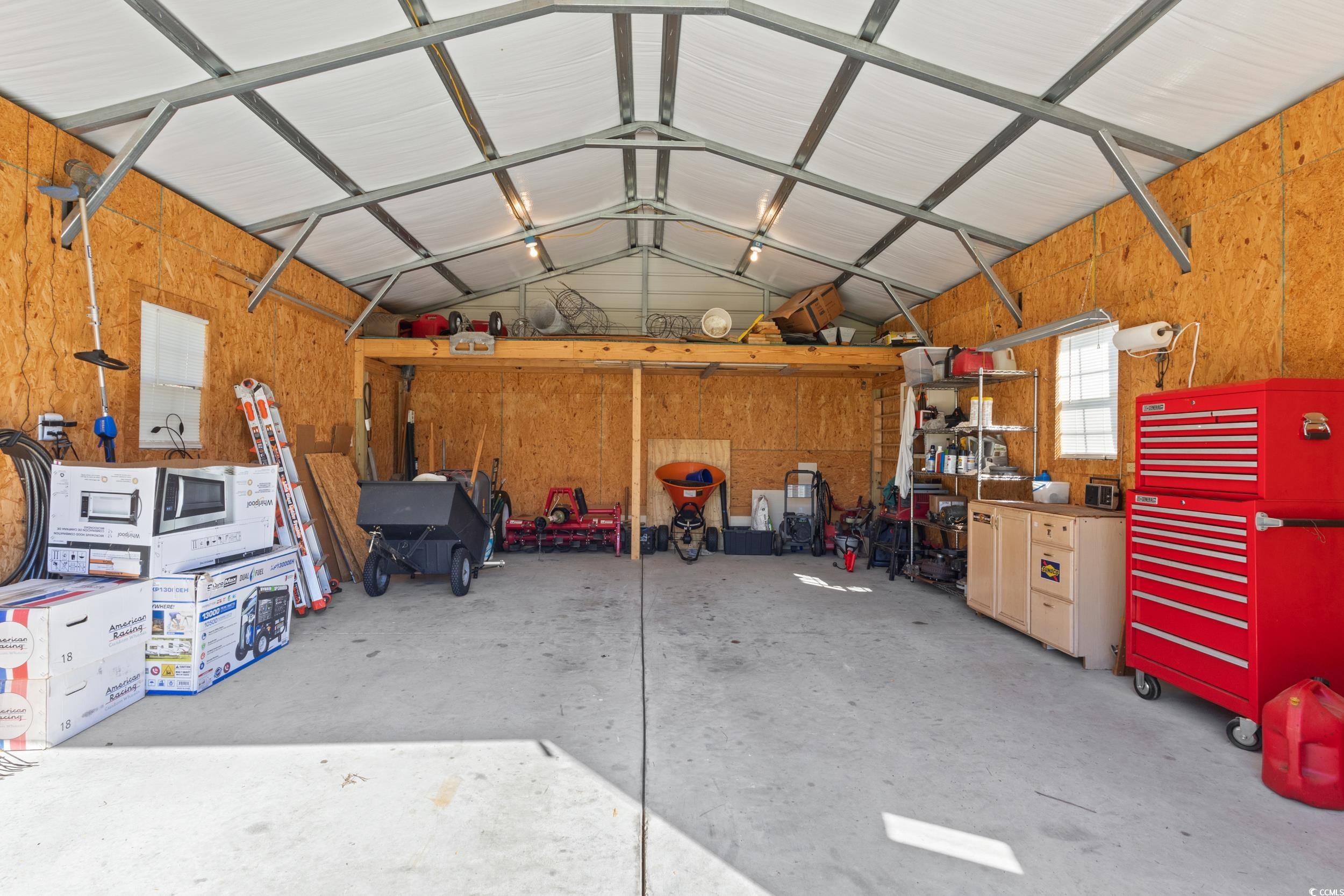 1353 Hucks Road Aynor, SC 29511 - Photo 38 of 40 Barn with wood walls and a workshop area