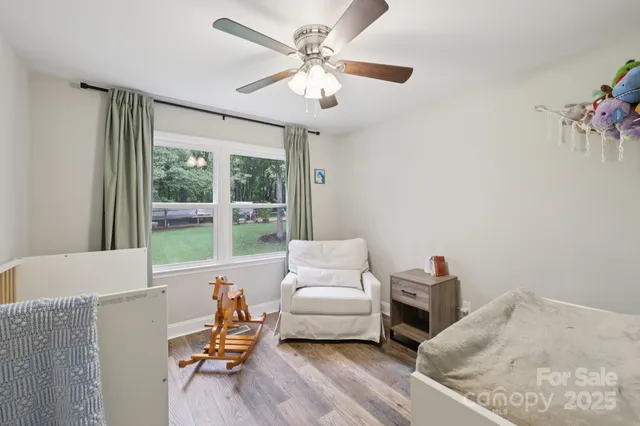a bedroom with furniture and a window