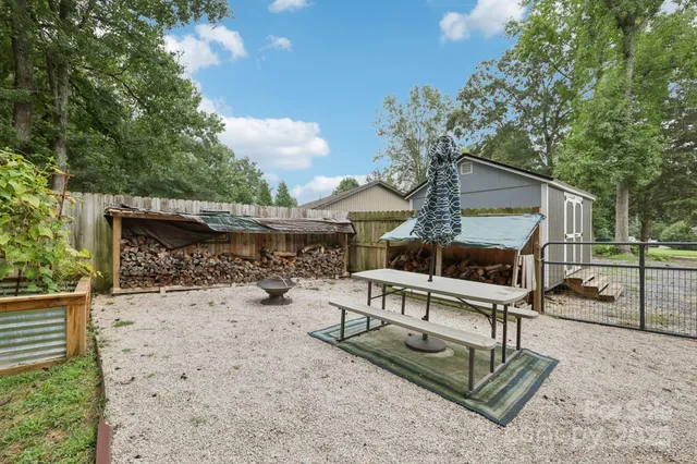 a view of a park with large trees