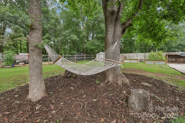 a view of a chair and table on the grass