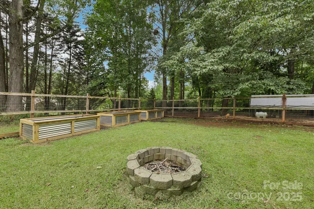 a view of a park with swings and a slide