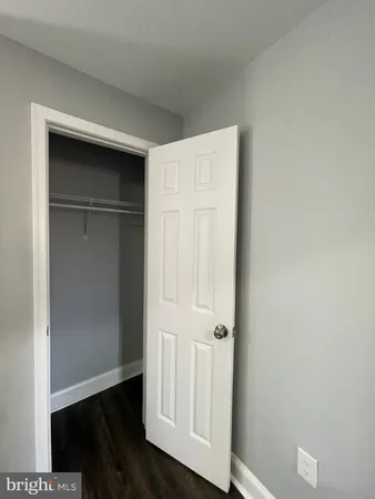 a view of front door with wooden floor