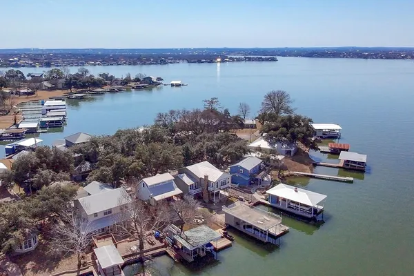 an aerial view of a house with sitting space and lake view