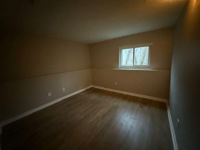 5455 North Main Street, Unit 12A Fall River, MA 02720 - Photo 16 of 16 a view of an empty room with wooden floor and a window
