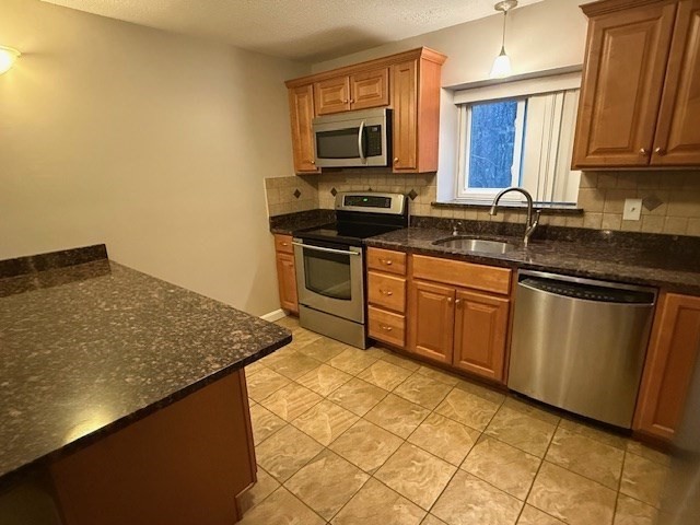 5455 North Main Street, Unit 12A Fall River, MA 02720 - Photo 5 of 16 a kitchen with granite countertop a sink stove and microwave