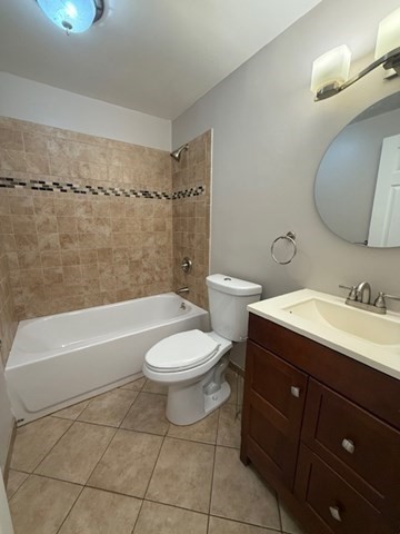 5455 North Main Street, Unit 12A Fall River, MA 02720 - Photo 10 of 16 a bathroom with a toilet a sink a mirror a bathtub and shower