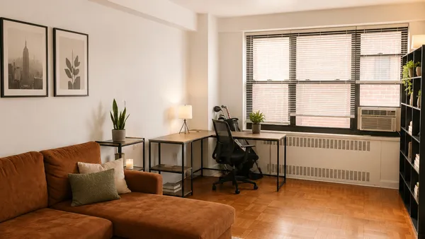 a living room with furniture and a window