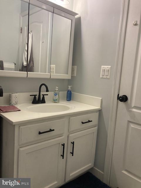 11147 Wortham Crest Circle Manassas, VA 20109 - Photo 6 of 8 a bathroom with a sink and a mirror