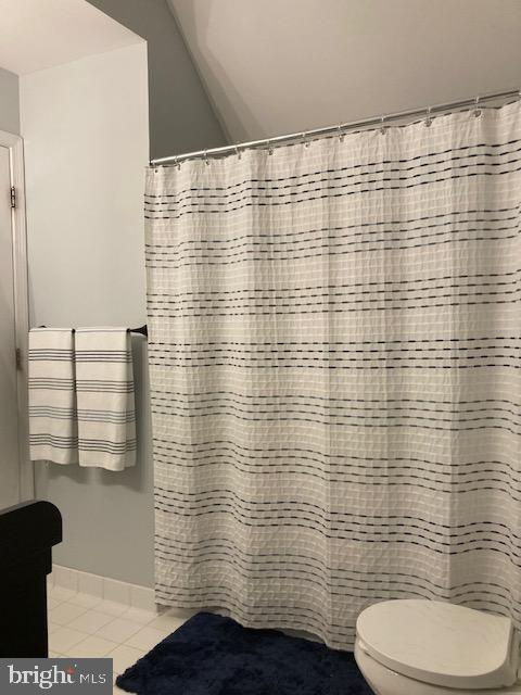 11147 Wortham Crest Circle Manassas, VA 20109 - Photo 7 of 8 a bathroom with a toilet and a shower curtain