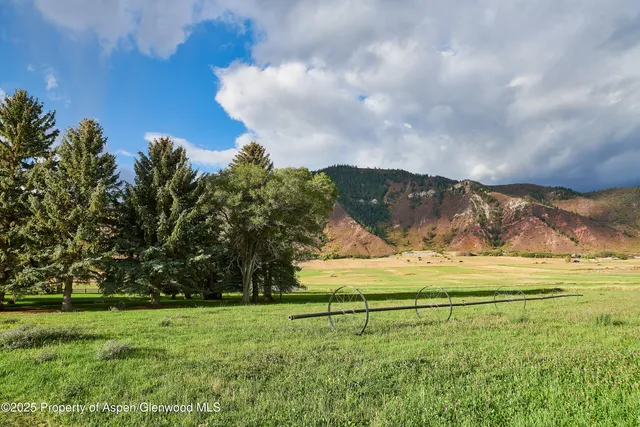 a view of a house with a big yard