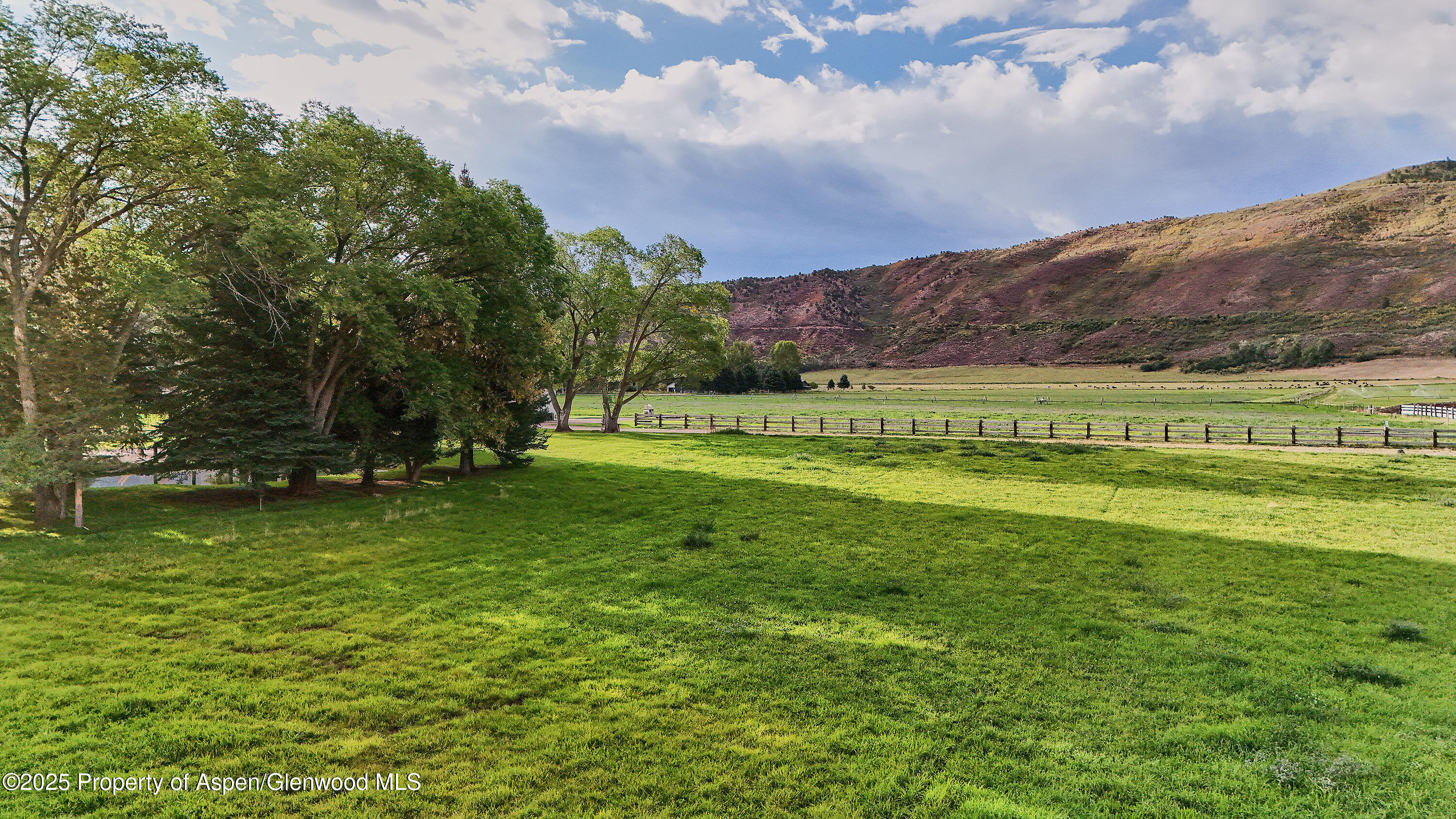 2700 Emma Road Basalt, CO 81621 - Photo 22 of 36 a view of a golf course with a lake
