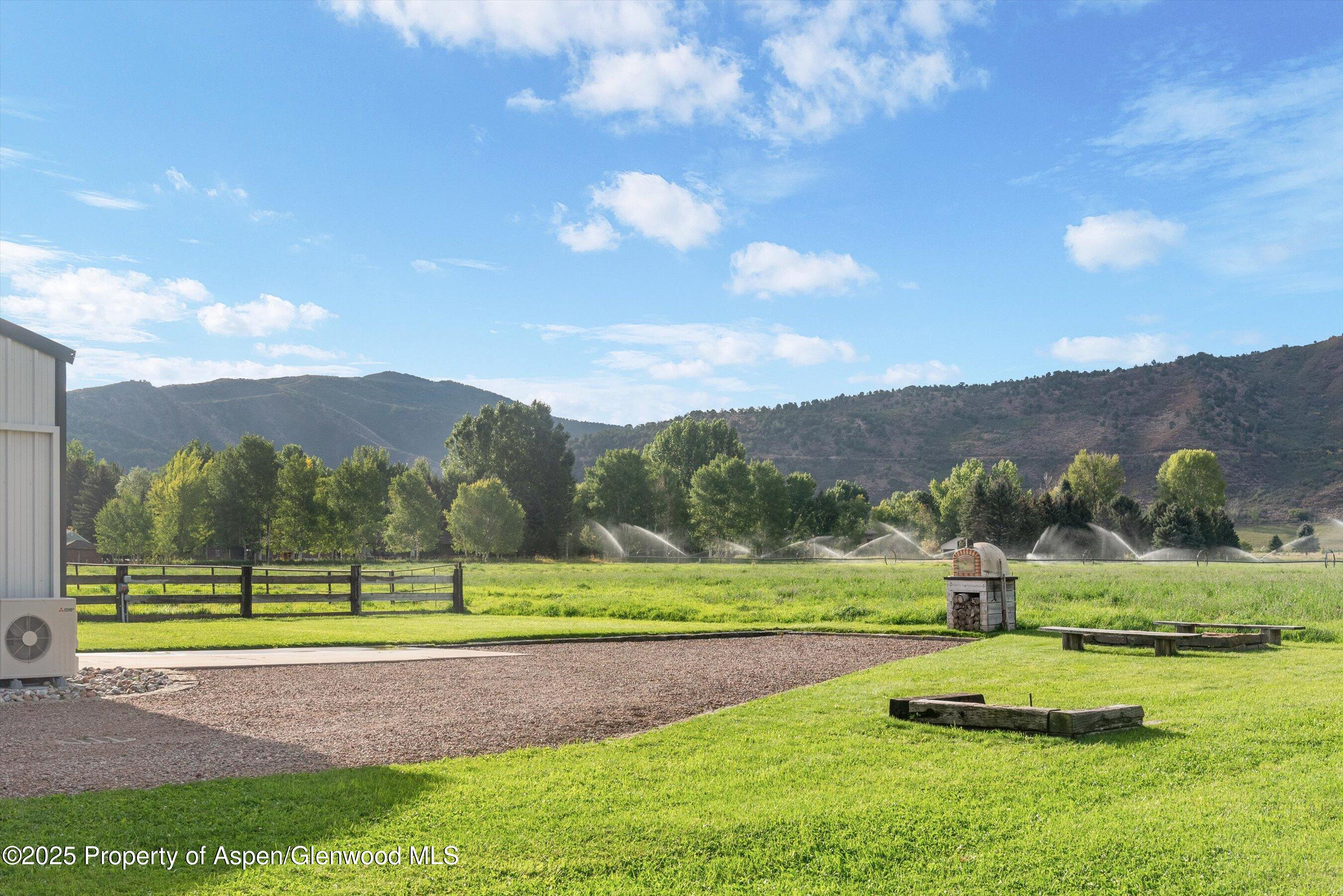 2700 Emma Road Basalt, CO 81621 - Photo 25 of 36 a view of a golf course with a garden