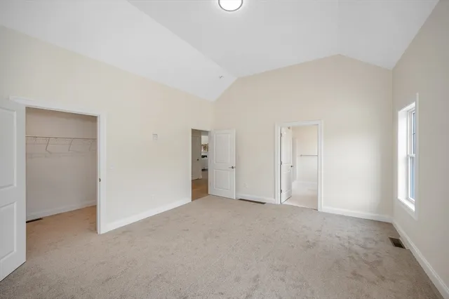 an empty room with closet area