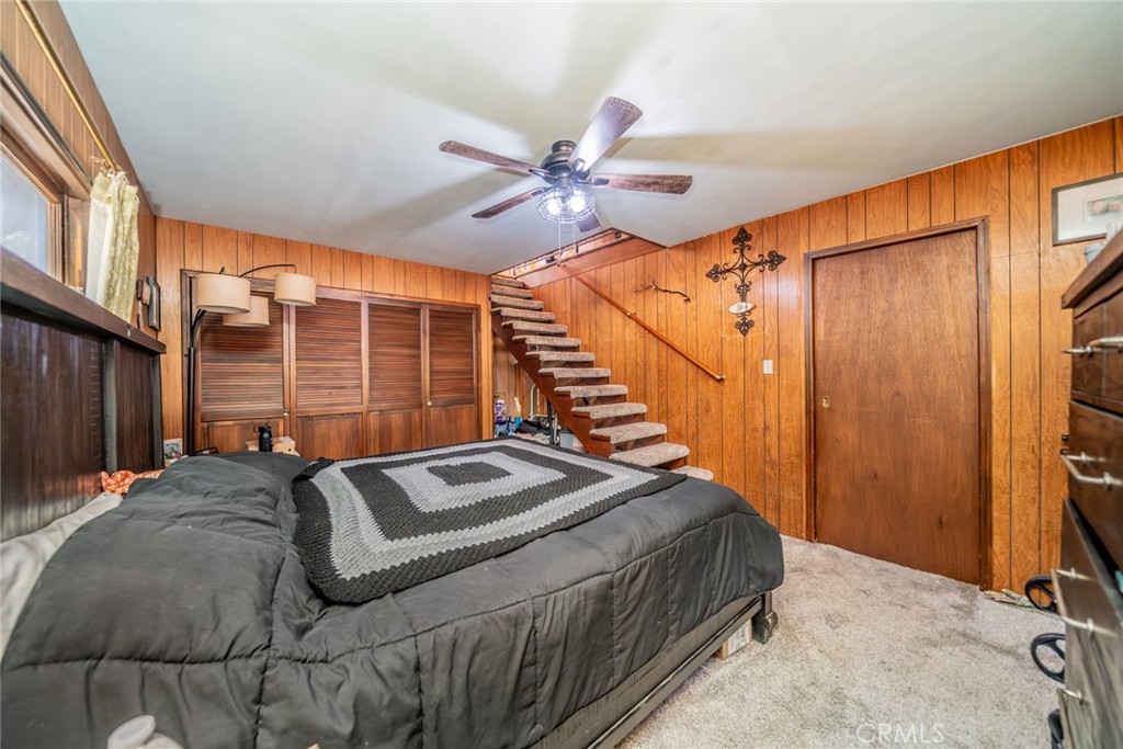 52647 Pine Cove Road Idyllwild, CA 92549 - Photo 7 of 35 a bed sitting in a bedroom next to a window