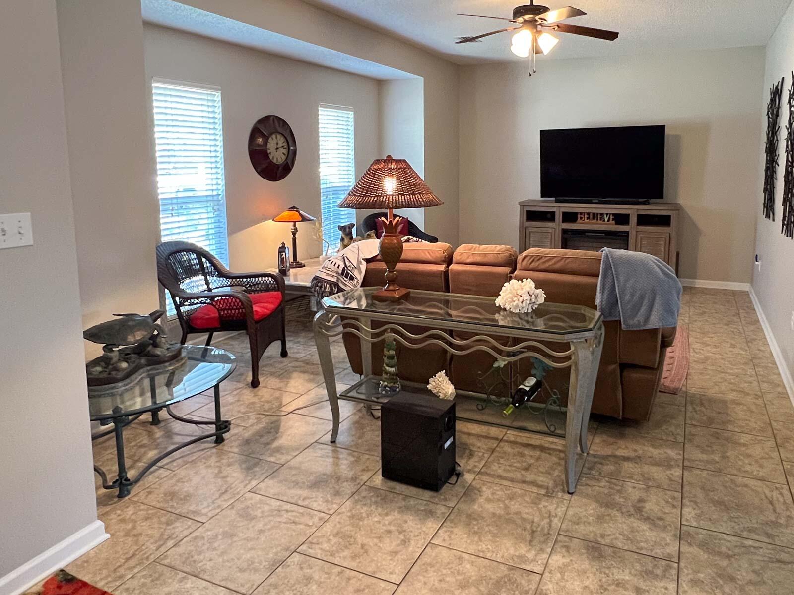 5213 Moore Loop Crestview, FL 32536 - Photo 54 of 77 a living room with furniture and a flat screen tv