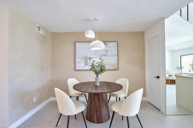 a kitchen with a sink and a mirror