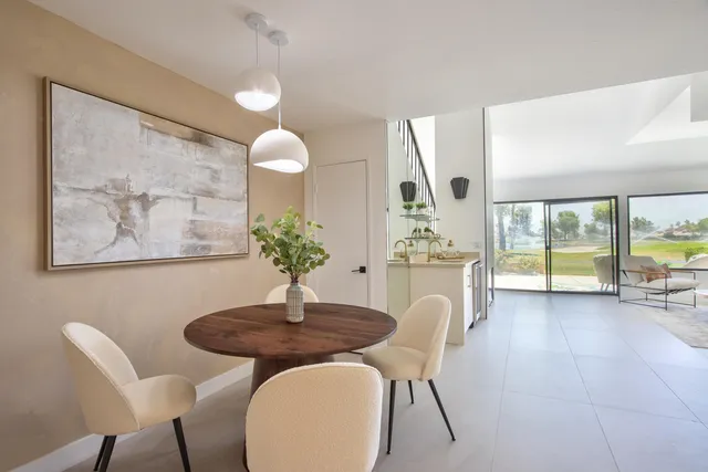 a spacious bedroom with a bed and a couch