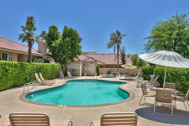 a view of an outdoor space pool patio and mountain view