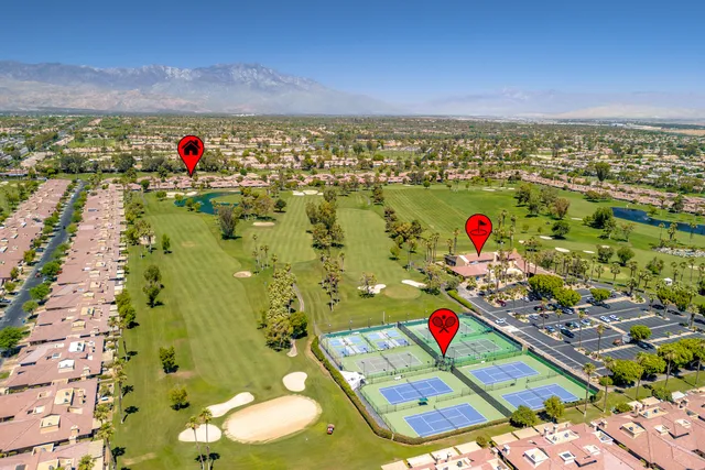 a view of a swimming pool with a yard