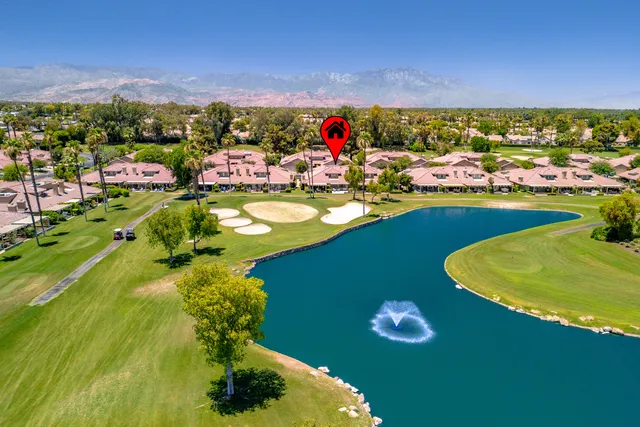 swimming pool with outdoor seating and yard