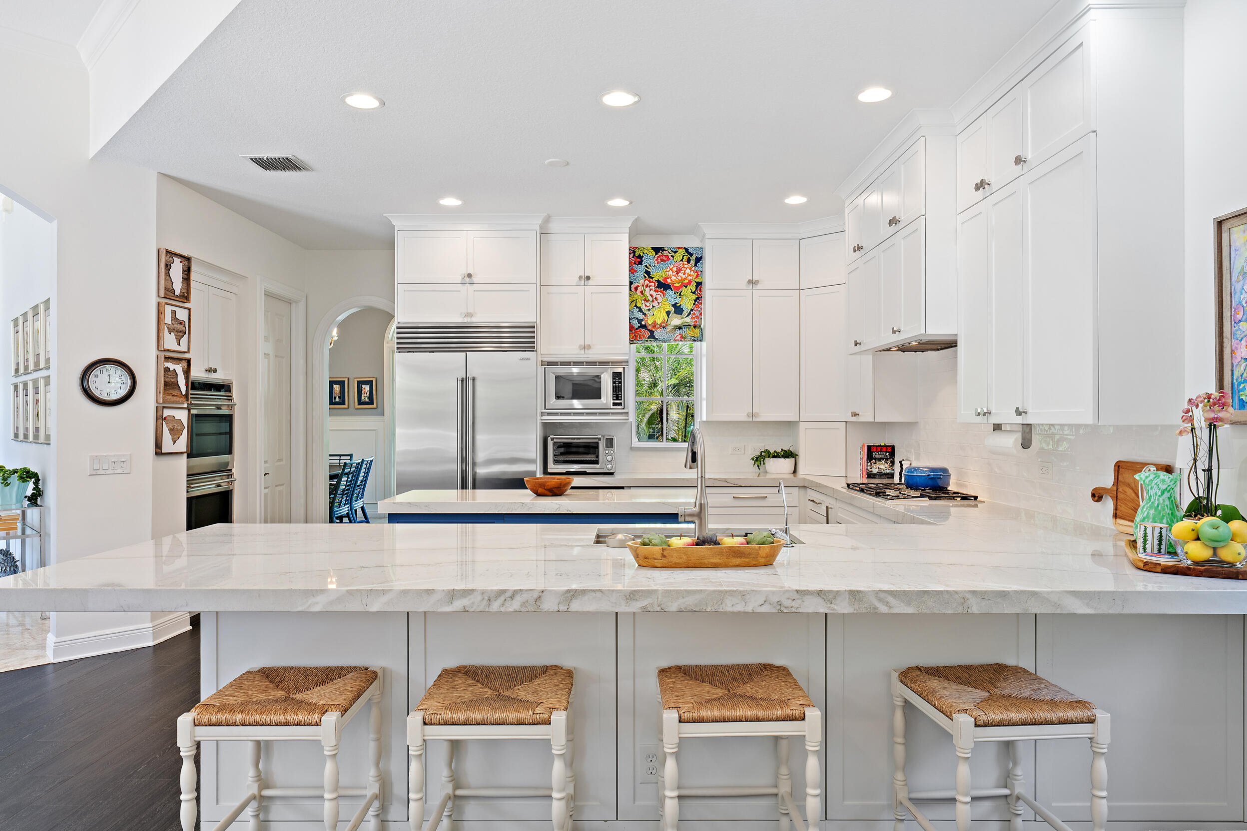 105 Segovia Way Jupiter, FL 33458 - Photo 10 of 33 a kitchen with cabinets a sink and chairs