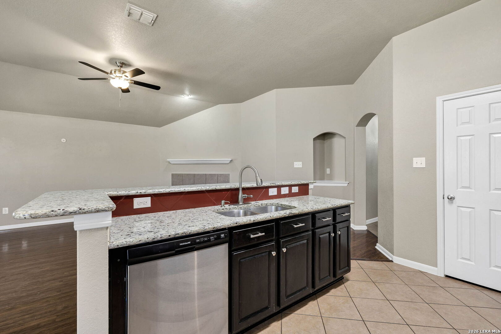 4015 Shervin Way Converse, TX 78109 - Photo 16 of 43 a kitchen with stainless steel appliances granite countertop a sink and a stove