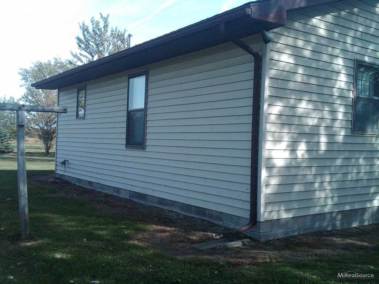9612 Imlay City Road Avoca, MI 48006 - Photo 2 of 5 This is a view of the back of the garage on the property.