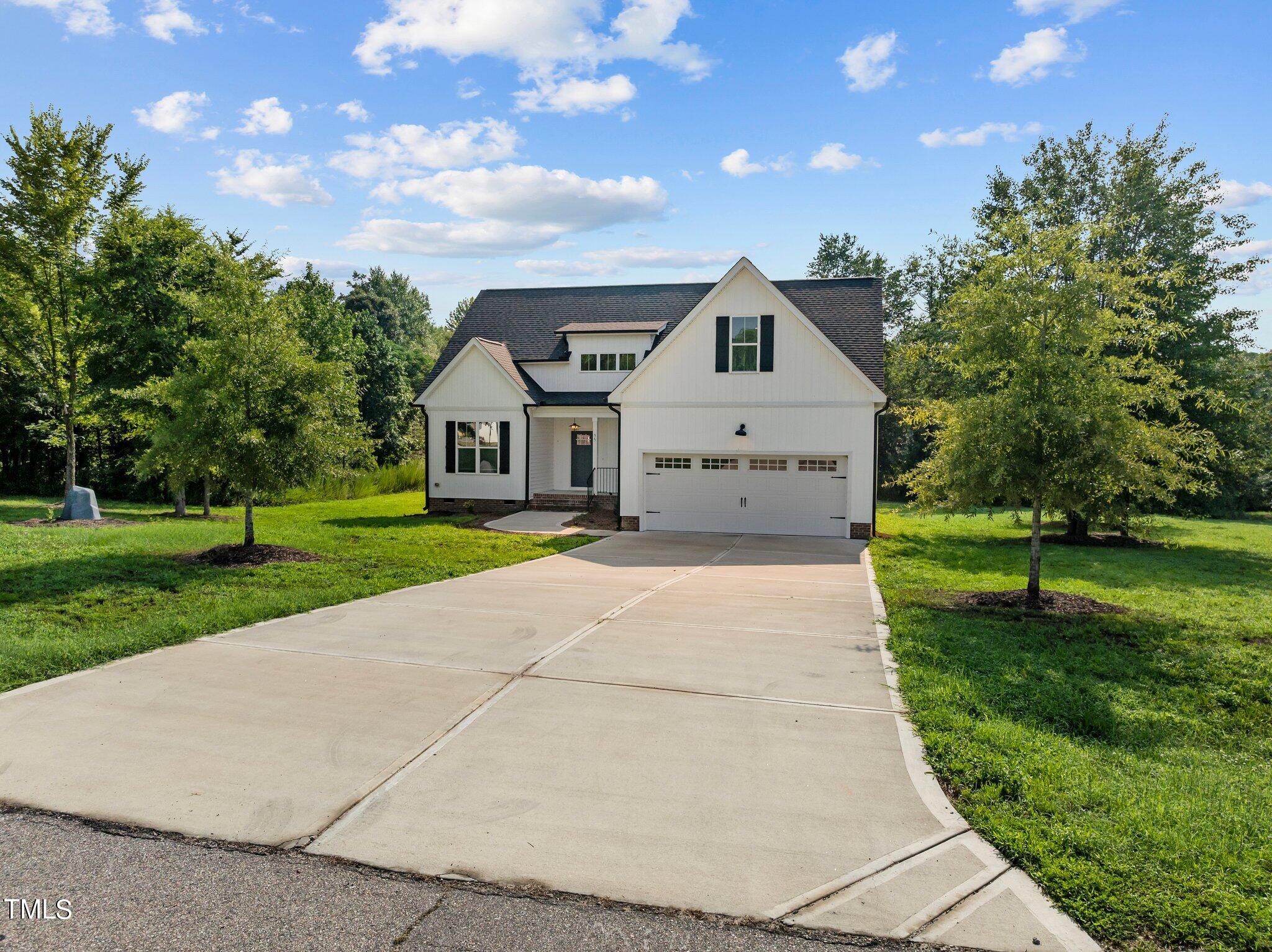 55 Pilot Ridge Road Zebulon, NC 27597 - Photo 54 of 55 a front view of a house with a yard