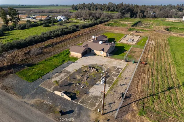 an aerial view of a house with a ocean view