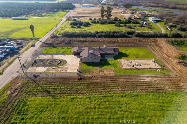 a view of a swimming pool with a table and chairs