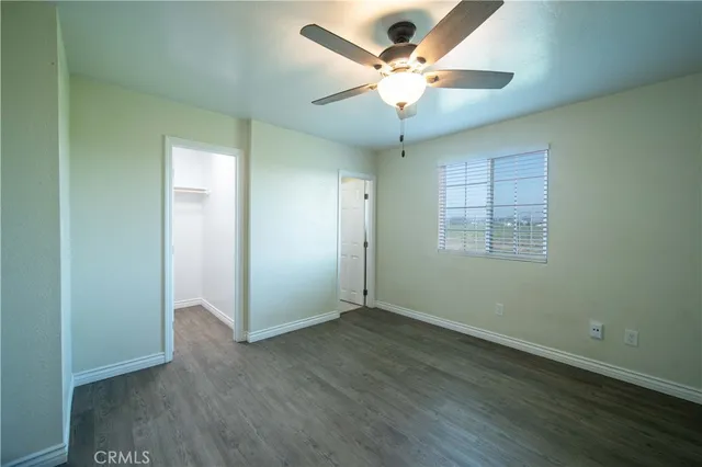 a view of a room with shelf on the wall
