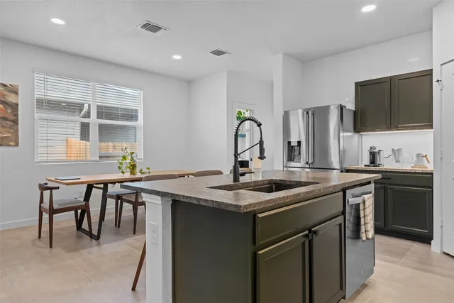 a kitchen with a sink and stove