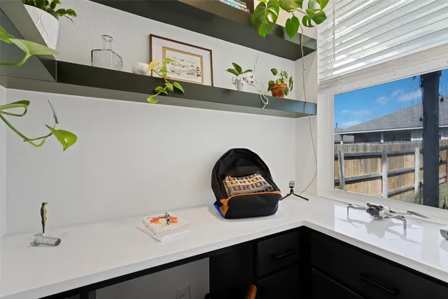 a bathroom with a sink a mirror and vanity