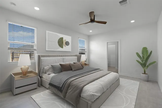 a bedroom with a bed and a couch