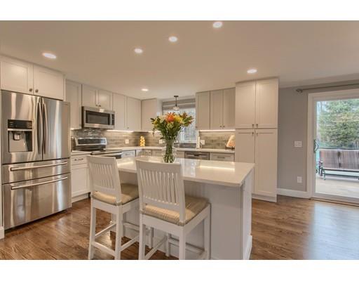 15 Skyline Drive Rutland, MA 01543 - Photo 2 of 30 a kitchen with stainless steel appliances granite countertop a refrigerator a sink a stove a dining table and chairs