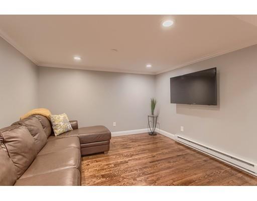 15 Skyline Drive Rutland, MA 01543 - Photo 25 of 30 a living room with a couch and a flat screen tv