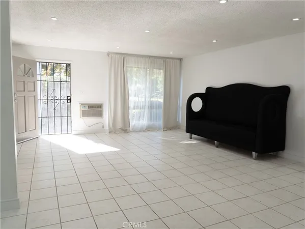 a view of livingroom with furniture and window