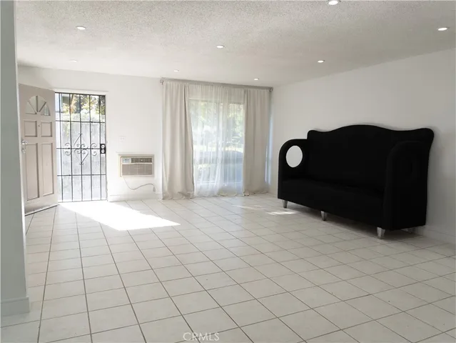a view of livingroom with furniture and window