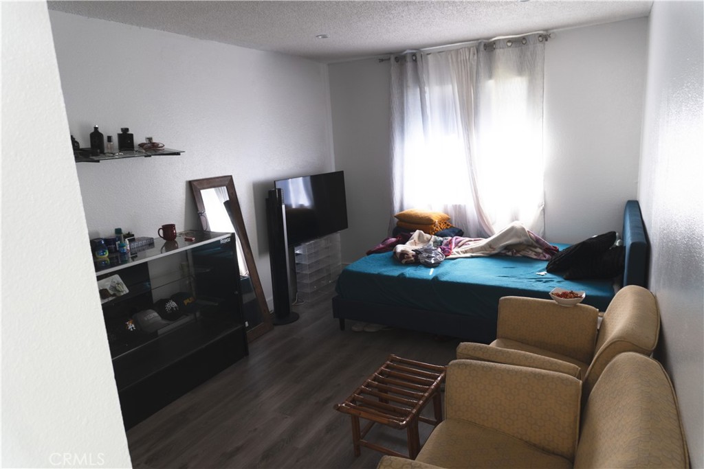 14802 Newport Avenue, Unit 2B Tustin, CA 92780 - Photo 9 of 13 a living room with furniture and a window