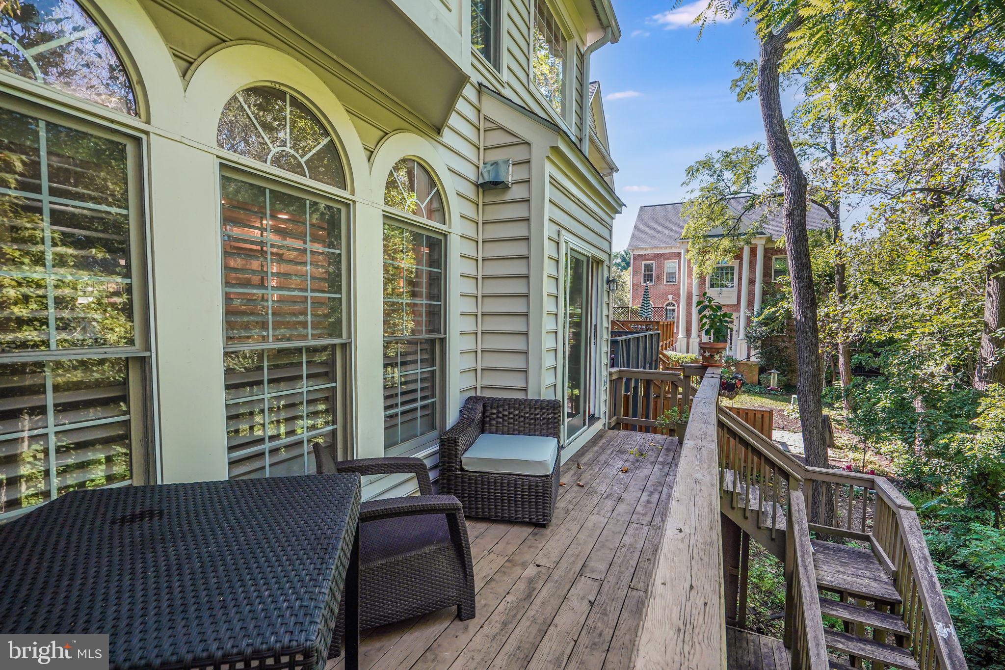 150 Rees Place Falls Church, VA 22046 - Photo 20 of 47 a view of a balcony with a couch and wooden floor