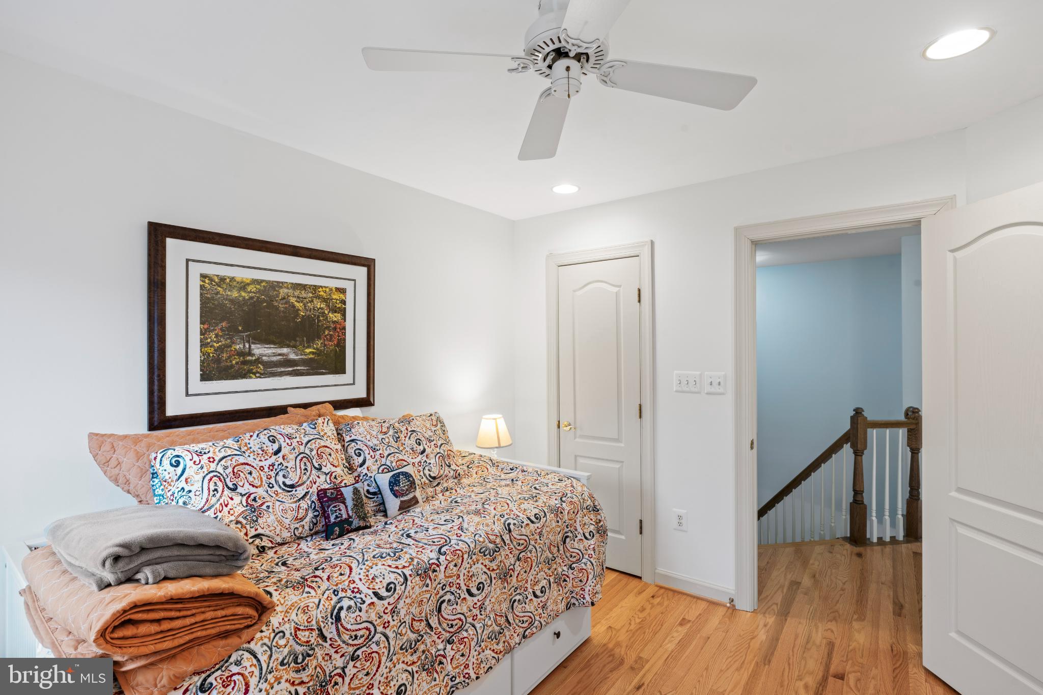 150 Rees Place Falls Church, VA 22046 - Photo 32 of 47 a bedroom with a bed and wooden floor