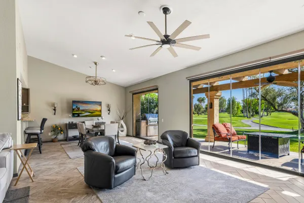 a living room with furniture and a large window