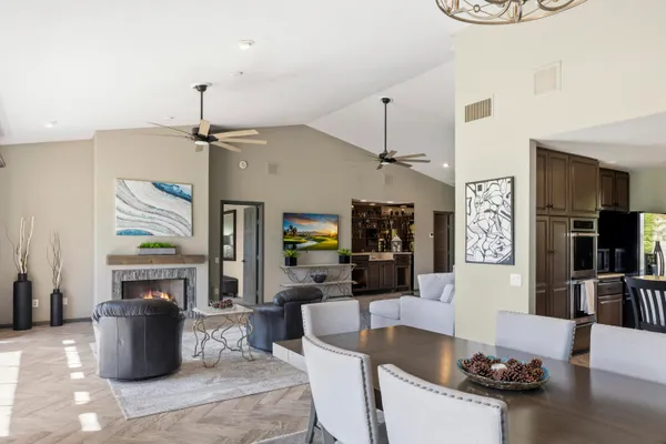 a living room with fireplace furniture and a flat screen tv