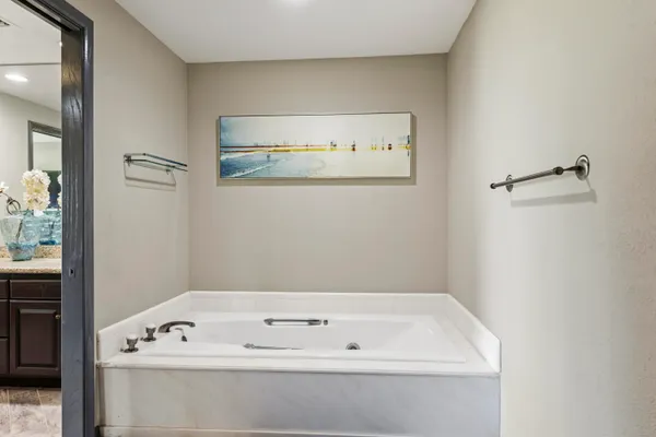 a bathroom with a bathtub and a window