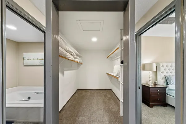 a view of a hallway view with wooden floor and staircase