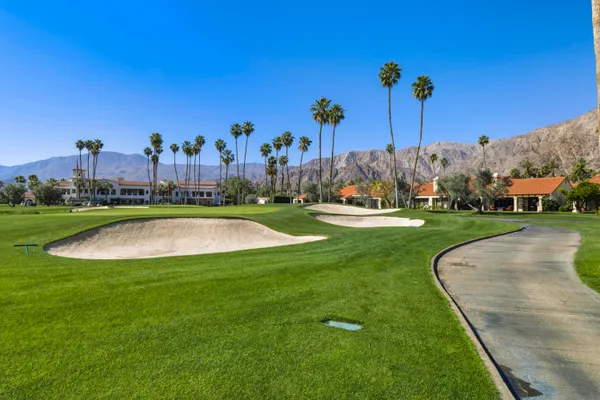 a view of a golf course with a big yard