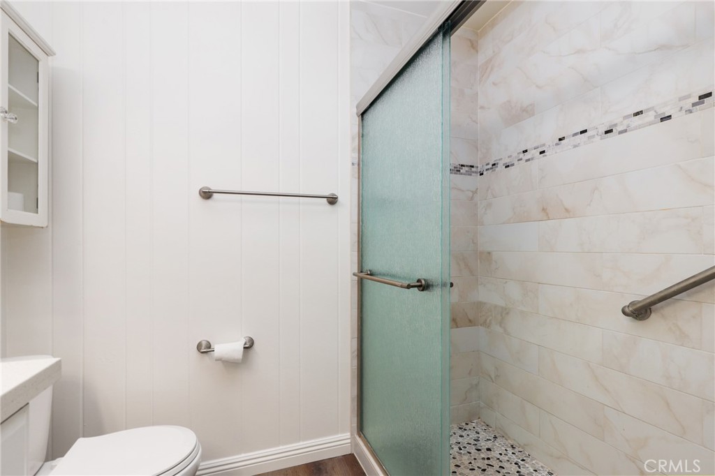 12200 Montecito Road, Unit D301 Seal Beach, CA 90740 - Photo 16 of 28 a bathroom with a toilet and a shower