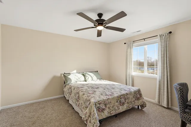 a bedroom with a bed and window